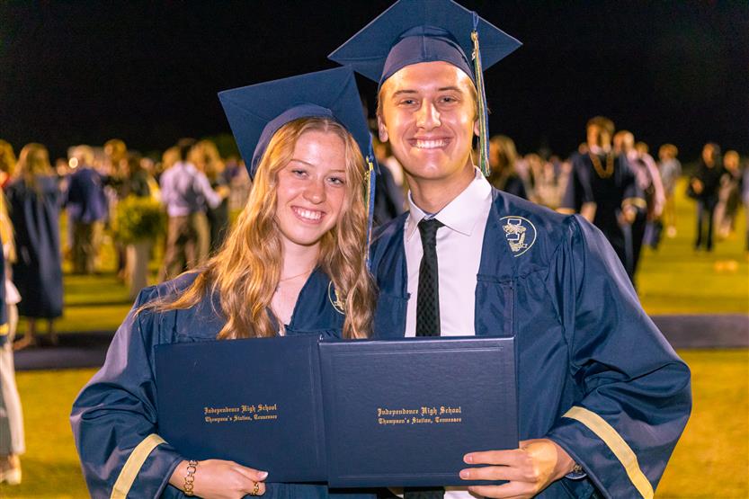 Students wearing blue graduation robes